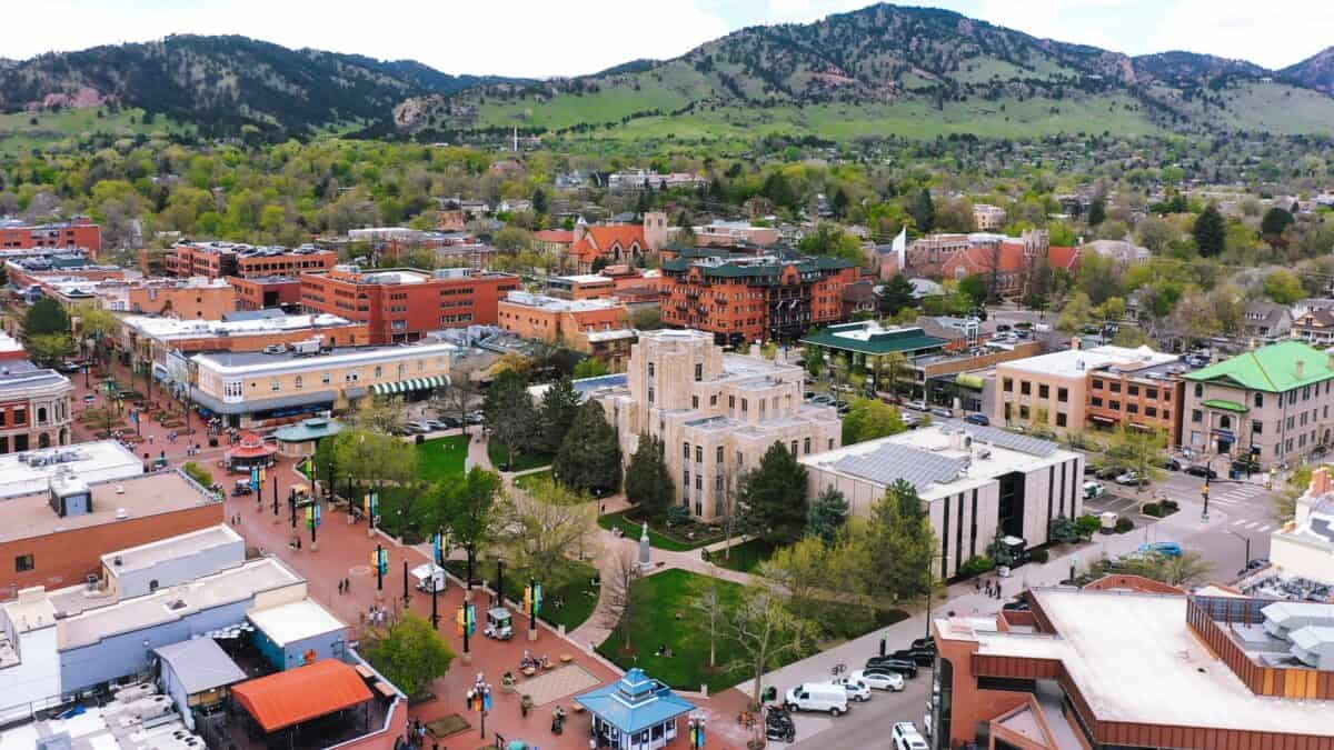 Aerial view of downtown Boulder, Colorado, with the Flatirons in the background