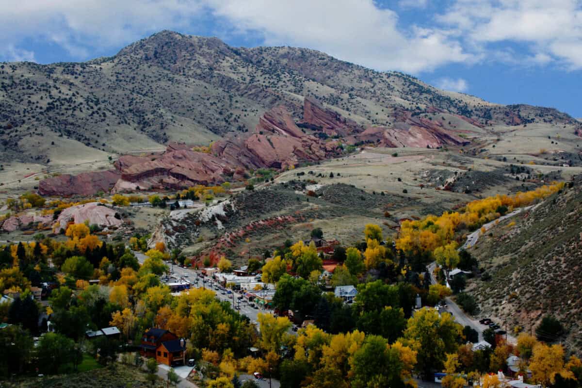 Aerial view of Morrison and Red Rocks beneath Colorado’s wooded foothills