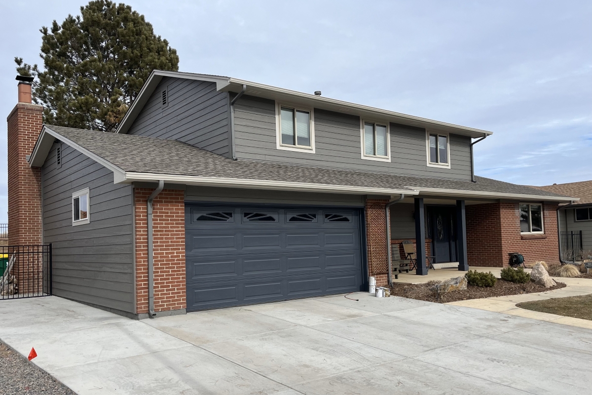 Littleton home with Tundra Grey LP ExpertFinish lap siding and Desert Stone fascia after hail damage