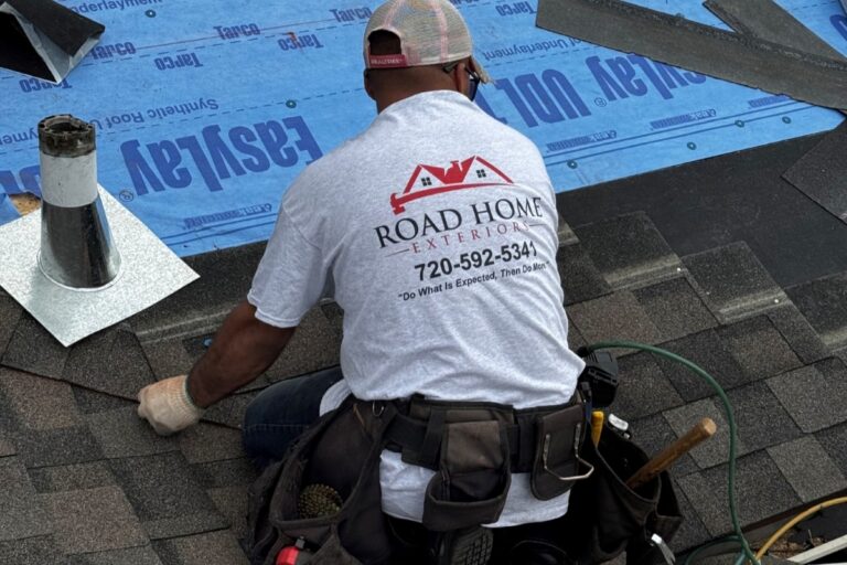 Road Home Exteriors roofer installing asphalt shingles during a roof replacement