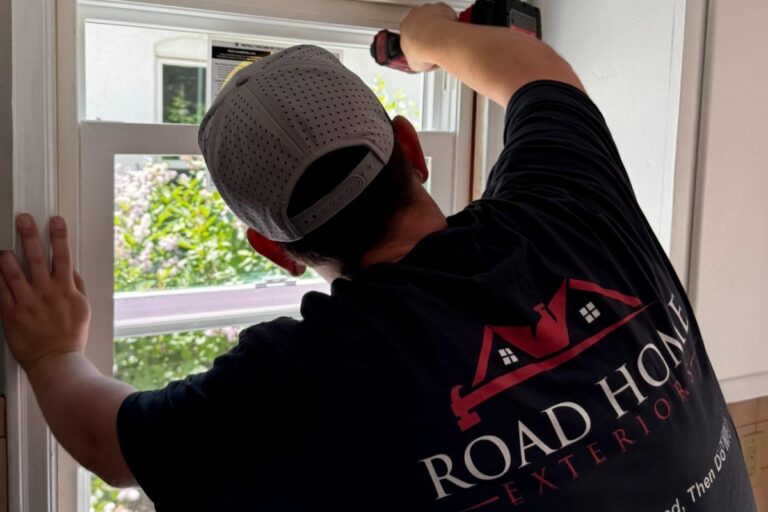 Road Home Exteriors installer replacing a residential window