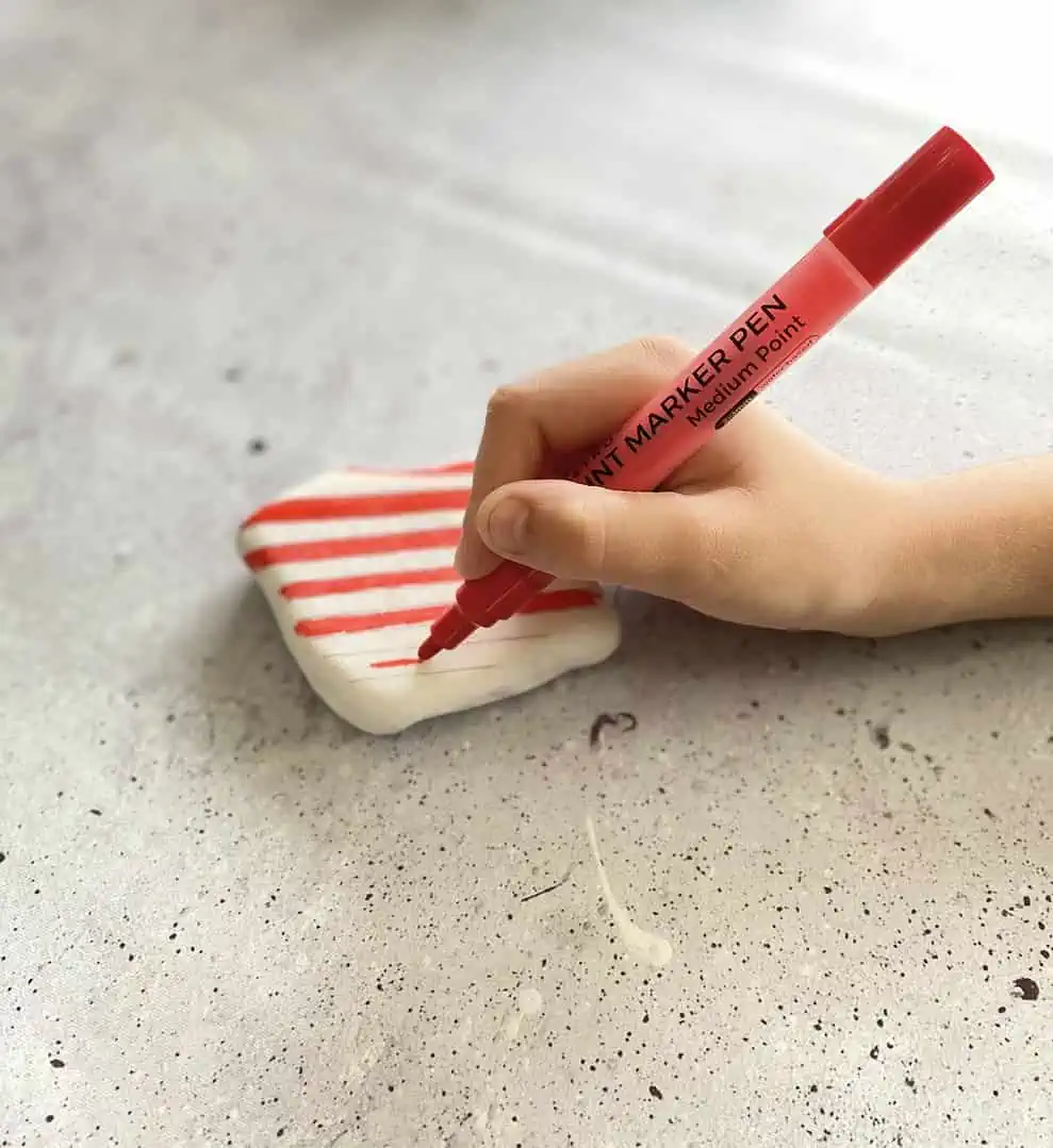 Harry Potter Painted Rocks: A Fun DIY Craft for Potterheads 4 painting stripes on a stone