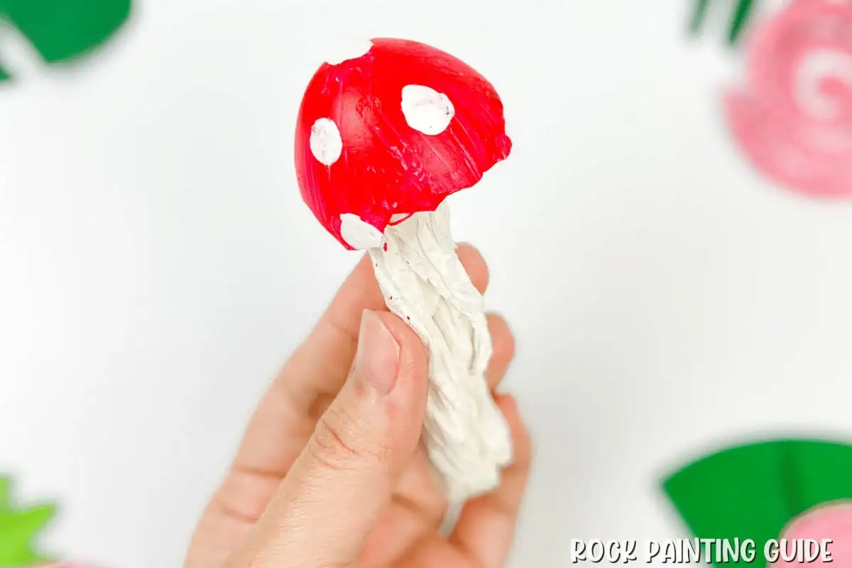 hand holding mushroom craft