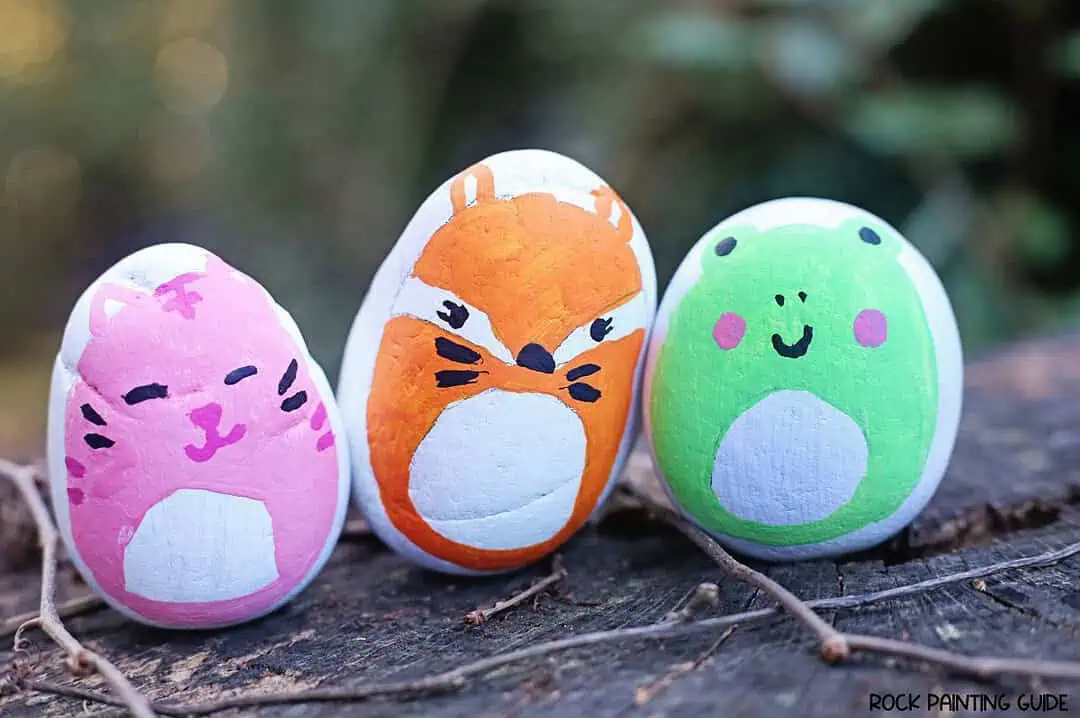 Squishmallows Painted Rocks: The Cutest DIY Craft Ever! 10 squishmallow painted rocks on tree branch