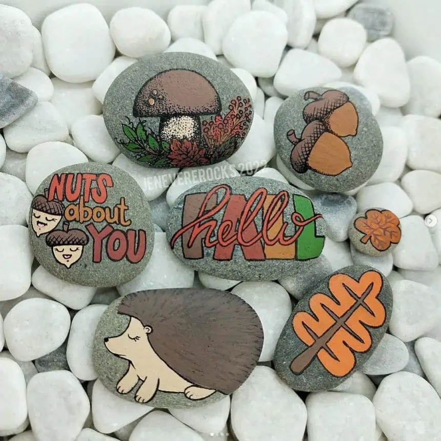 Home 5 Decorative painted rocks with autumn and fall-themed designs and messages.