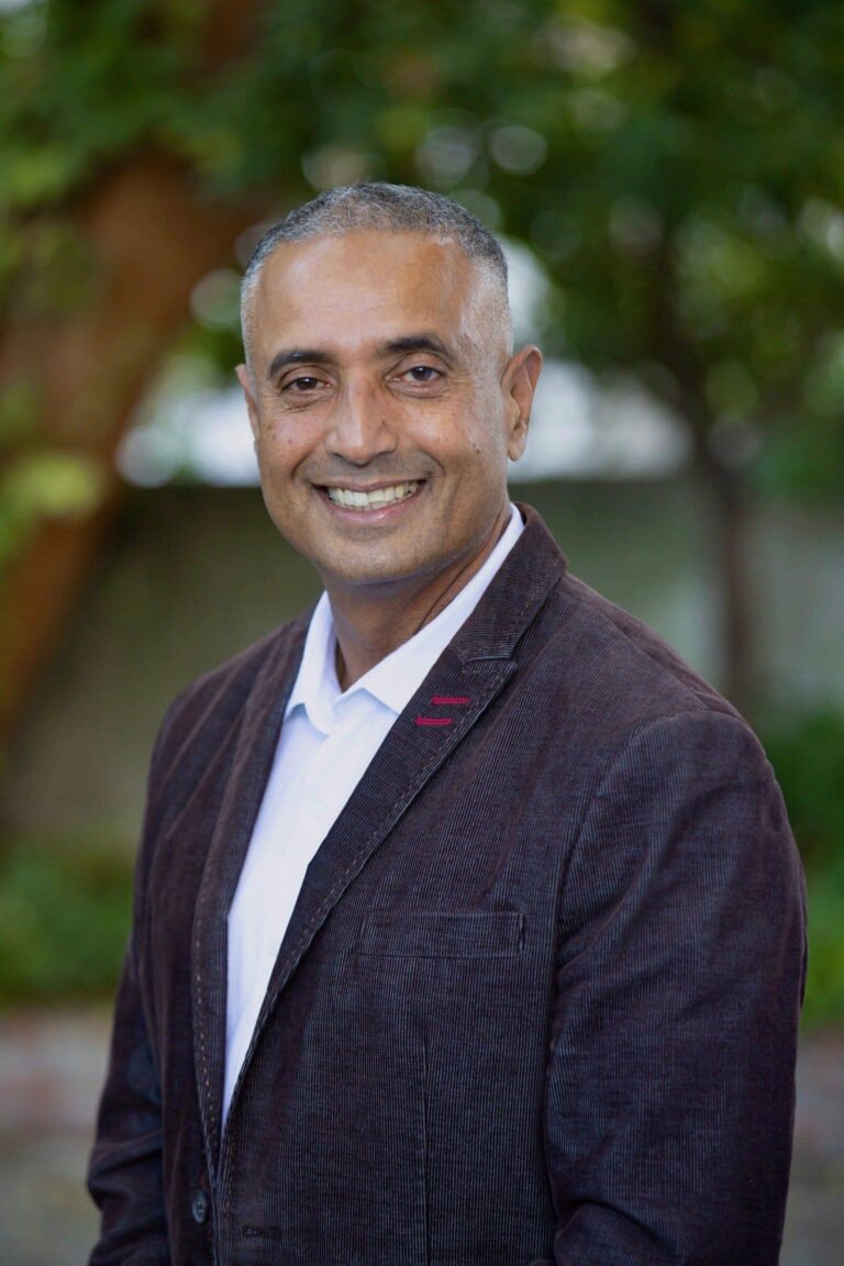 Ron Melvin smiling outdoors in Walnut Creek, CA.