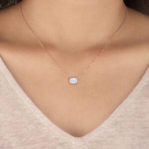 Elegant emerald bezel diamond pendant necklace for women.
