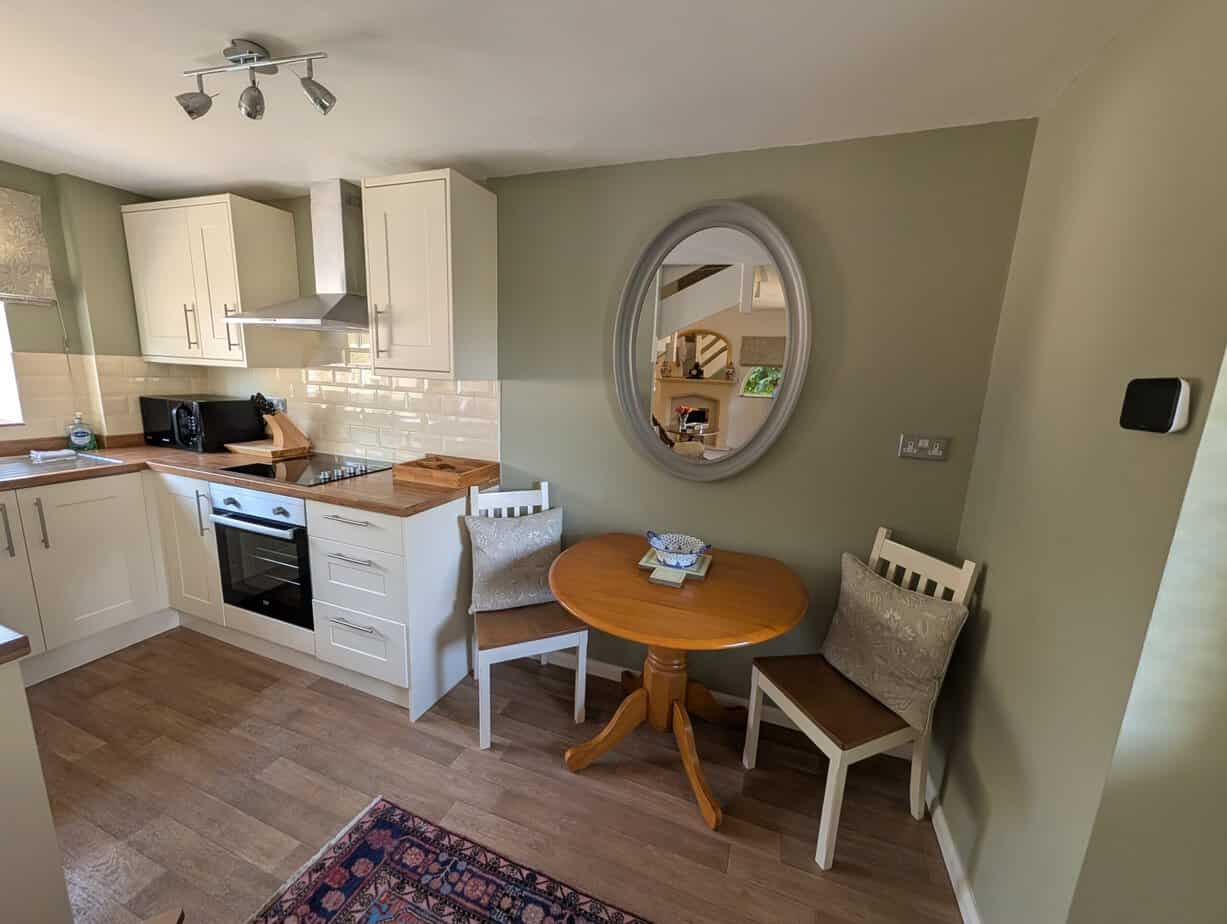 Fully equipped kitchen and dining area at The Saddlery Holiday Cottage
