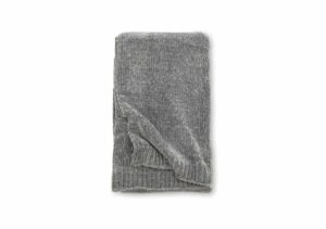 Mysig grå stickad handduk för badrum och spa, högkvalitativt och skön att använda.