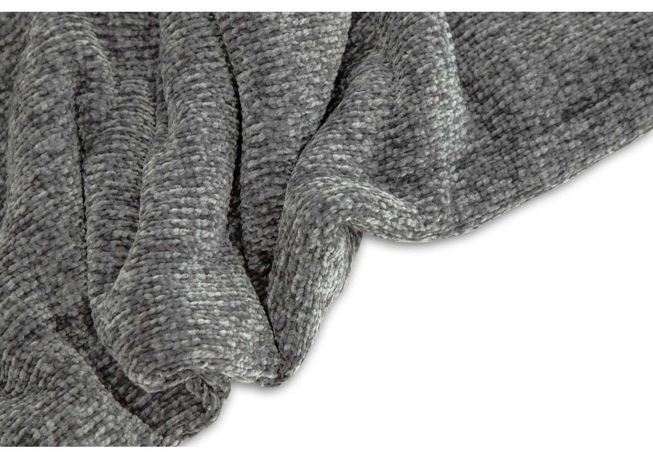 Mjuk och mysig bäddtextil i grått, perfekt för sovrum eller loungemiljö.