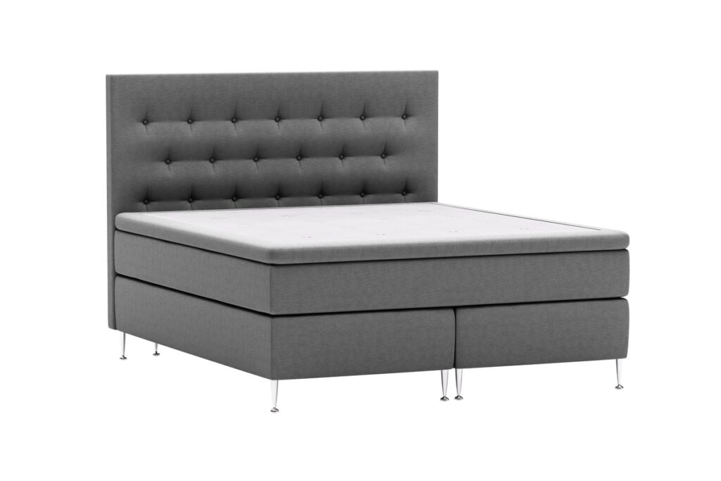 Modernt sängstativ med stoppad huvudgavel i grått, designad för komfort och stil.