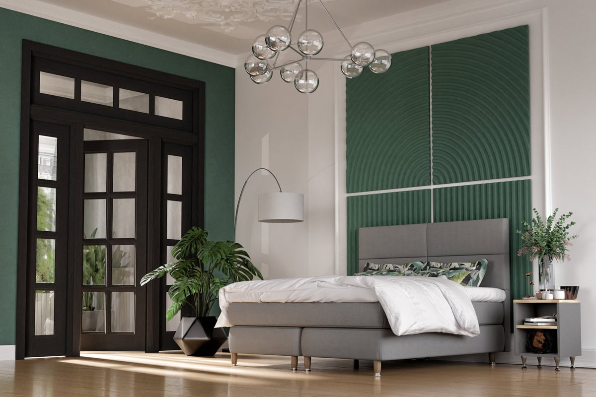 Elegantas sovrumsväggar med gröna paneler och mörkbryggd dörr i modern design.