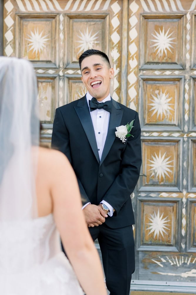 Groom turning around seeing his bride for the first time