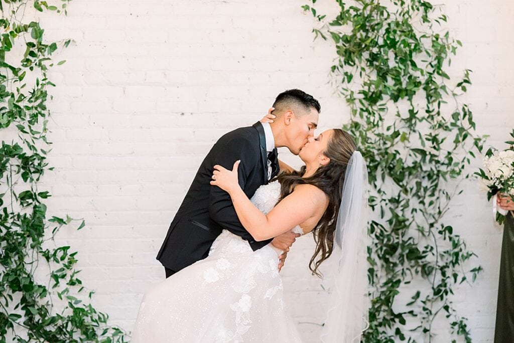 Bride and Groom sharing first kiss as husband and wife