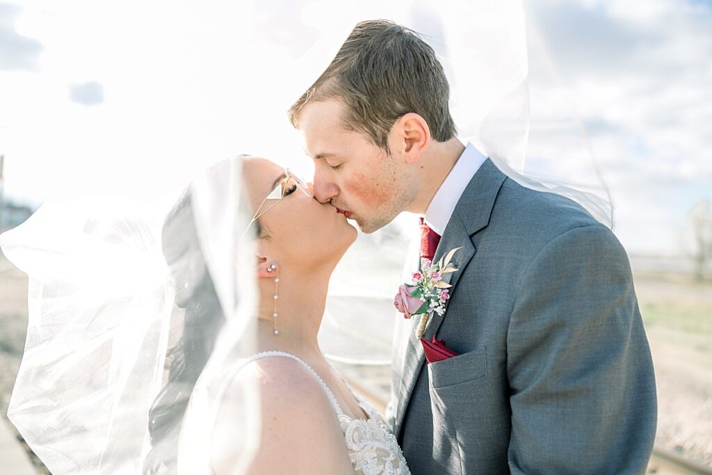 Bride and Groom wedding day veil portraits