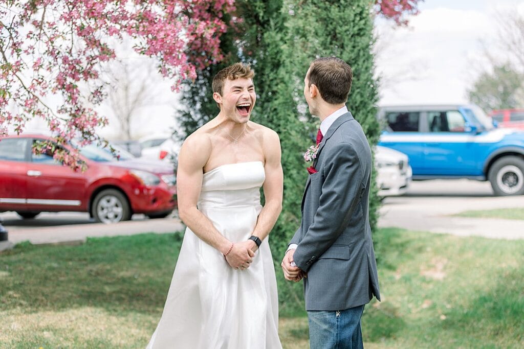 Best man laughing as he just pranked the groom