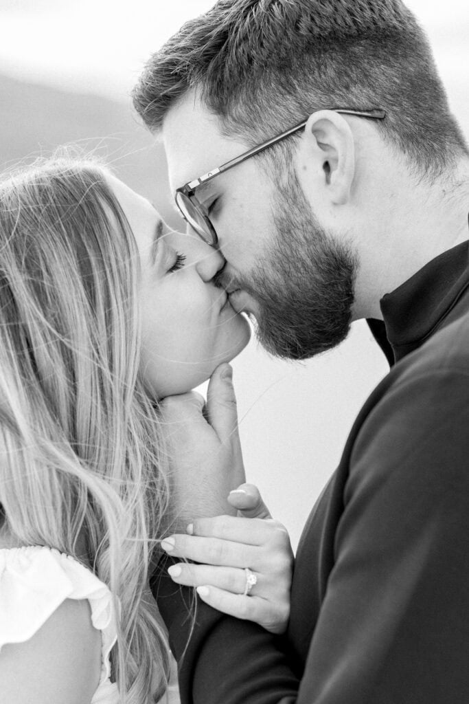 Close up ring shot while couple kisses