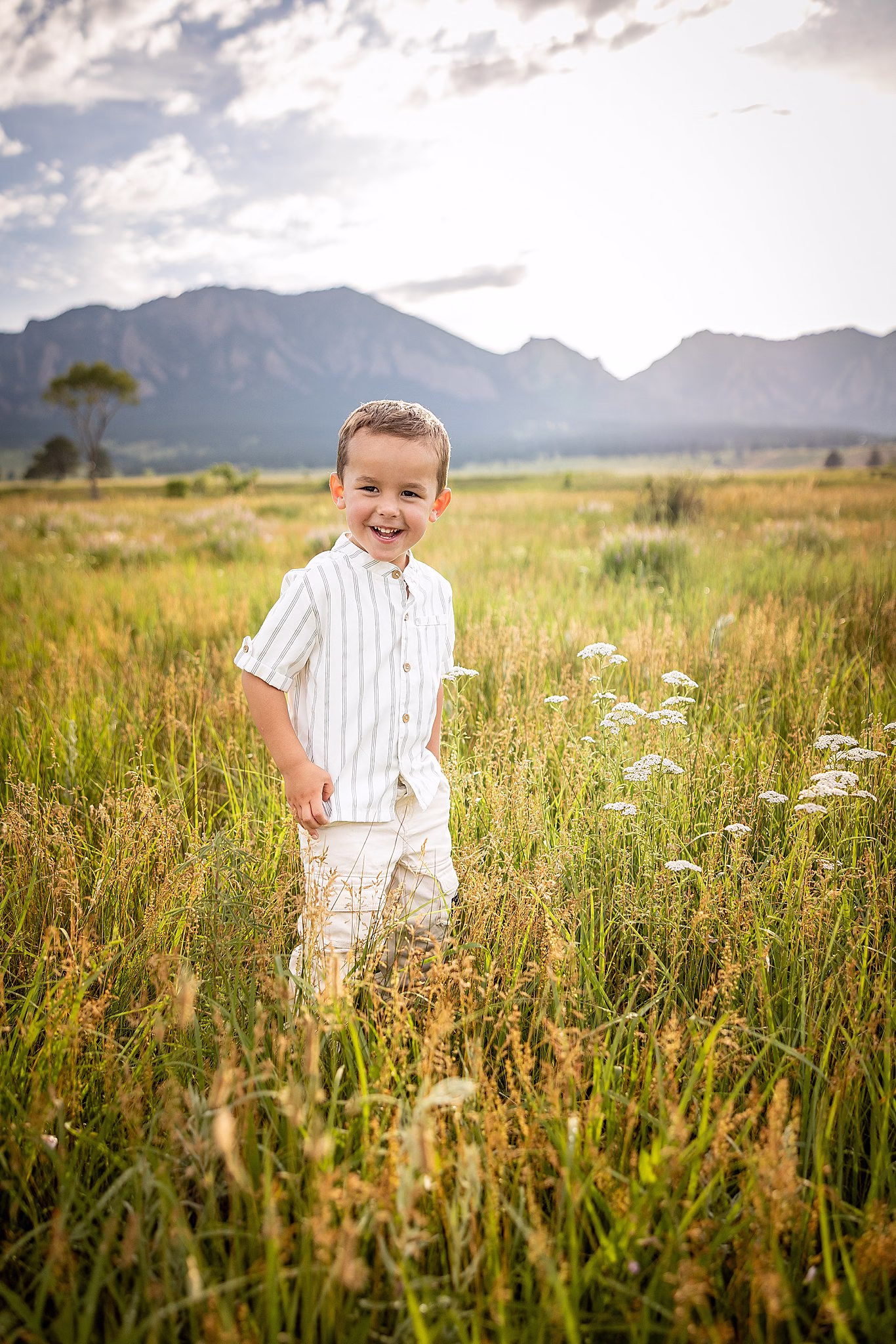 Boy standing in field in Boulder Colorado