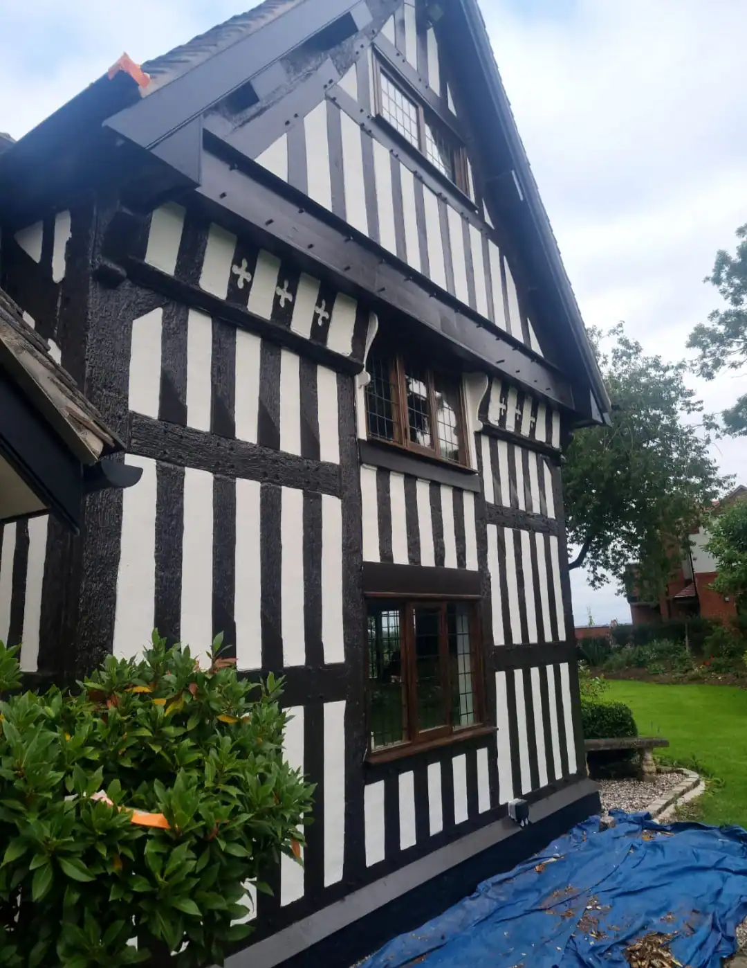 1. Traditional black and white Tudor style house exterior painting and decorating in the UK.