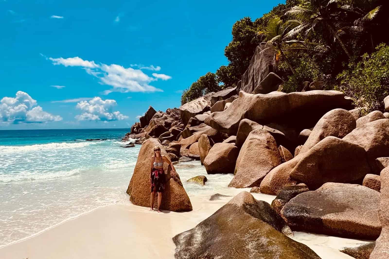 Petite Anse La Digue wild beach with pale sand, granite rocks and powerful surf