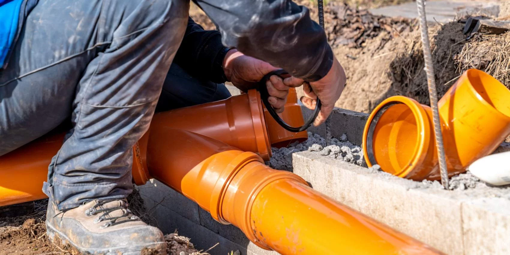 Plumber-fixing-a-sewer by Sheet Happens Plumbing and Drain