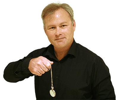 Man holding a pocket watch, smiling.