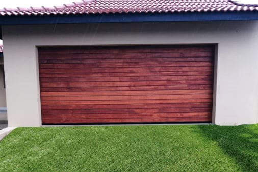 A single-panel garage door on a house