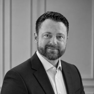 Professional portrait of Dayne Crockett, construction expert at Skyler Construction.