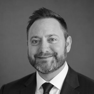 Professional portrait of Dustin Crockett, construction expert at Skyler Construction.