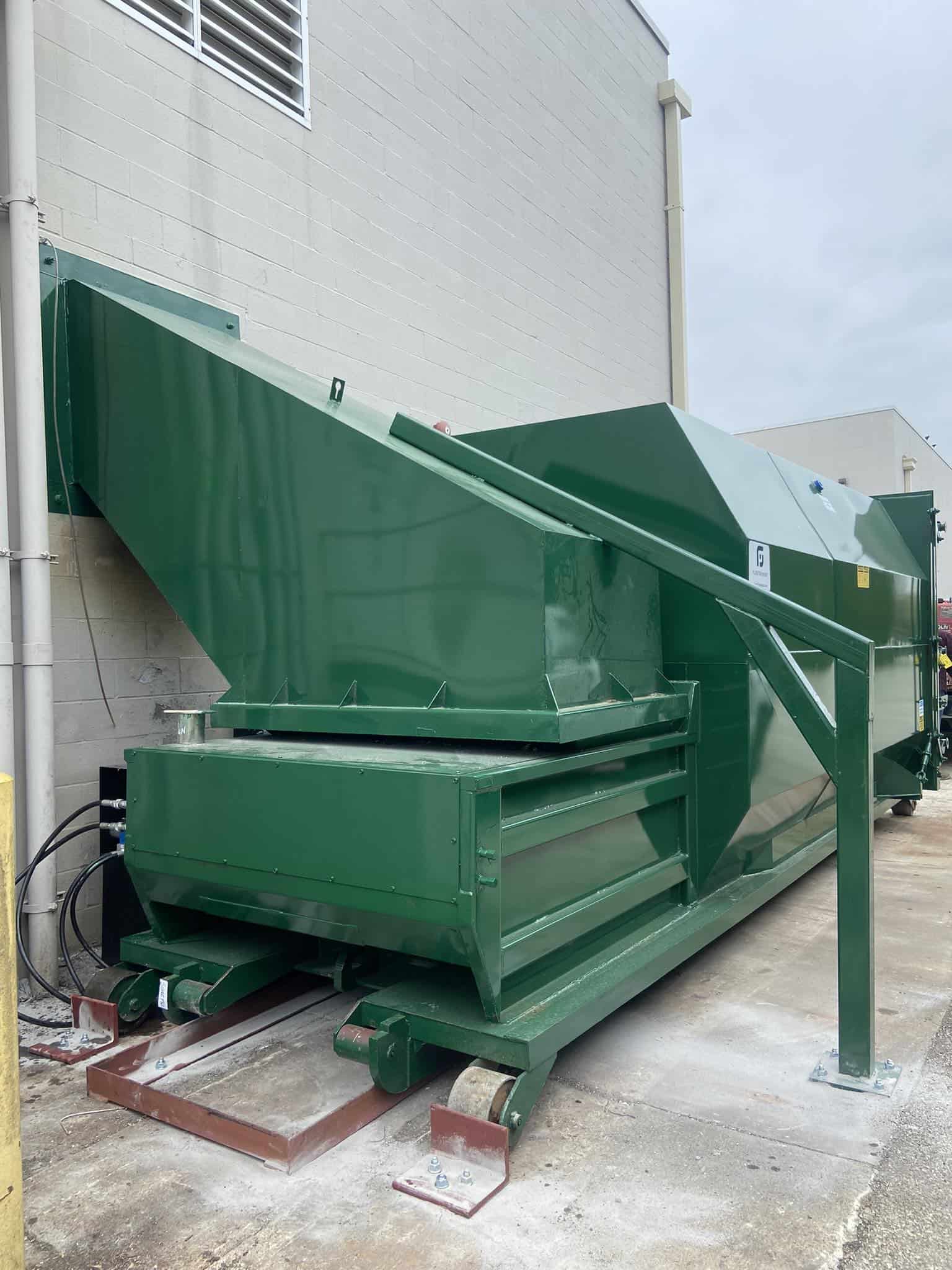 Industrial waste compactor for efficient waste management and recycling.