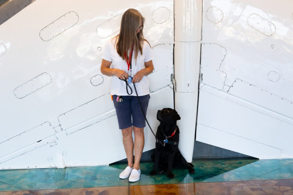 SBPaws therapy dog Tiki with their handler