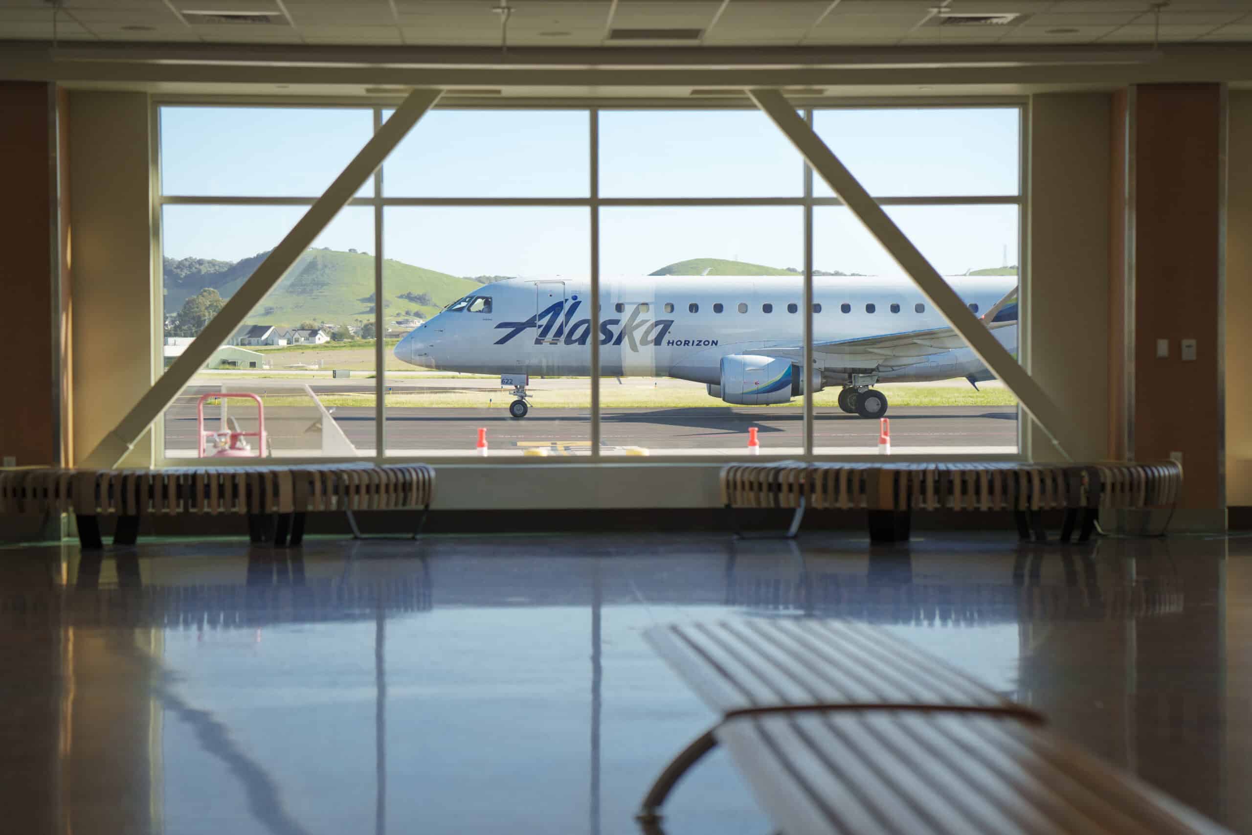 Alaska Airlines plane through the windows at SLO airport