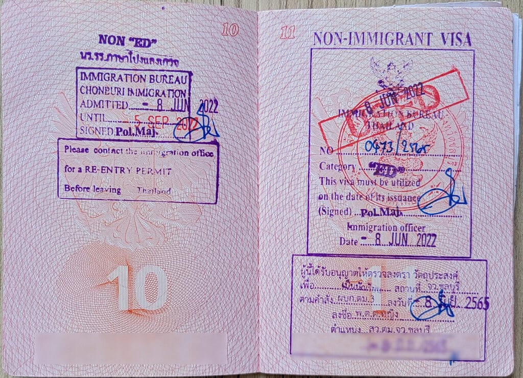Non-immigrant visa stamp with official seals and signatures.