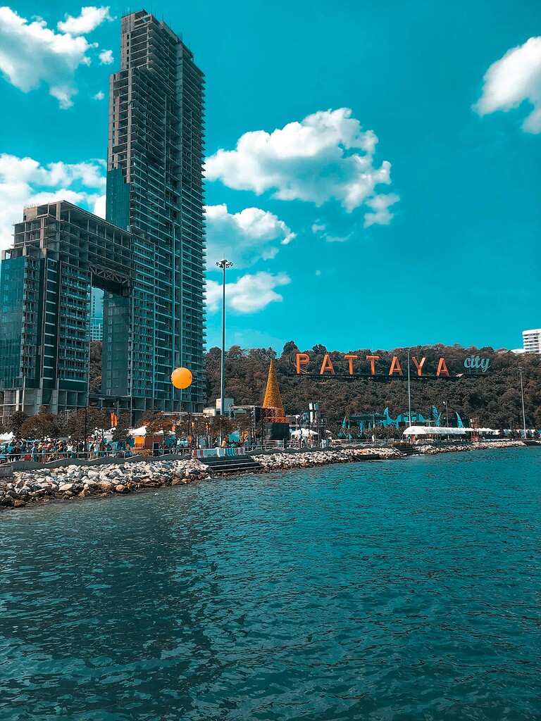 Beautiful view of Pattaya's skyline featuring high-rise buildings along the waterfront. Perfect for.