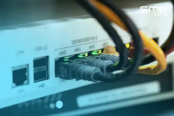 Network switch with Ethernet cables connected for data transfer.