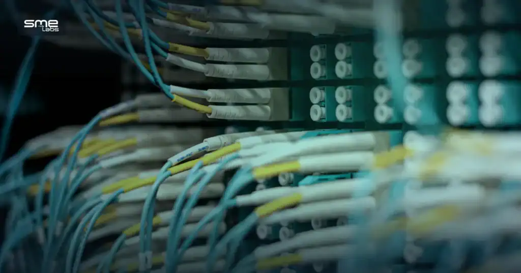 Fiber patch panel with organized cabling, representing NetBox and Ansible network automation