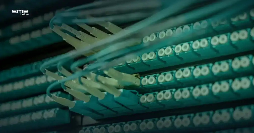 Fiber optic patch panel with connected cables, representing application-aware SD-WAN routing
