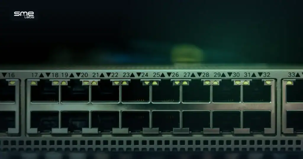 Close-up of a network switch with illuminated port LEDs