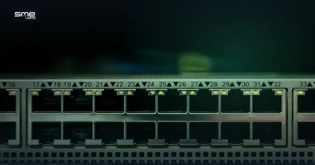 Close-up of a network switch with illuminated ethernet ports, representing Cisco certification career paths