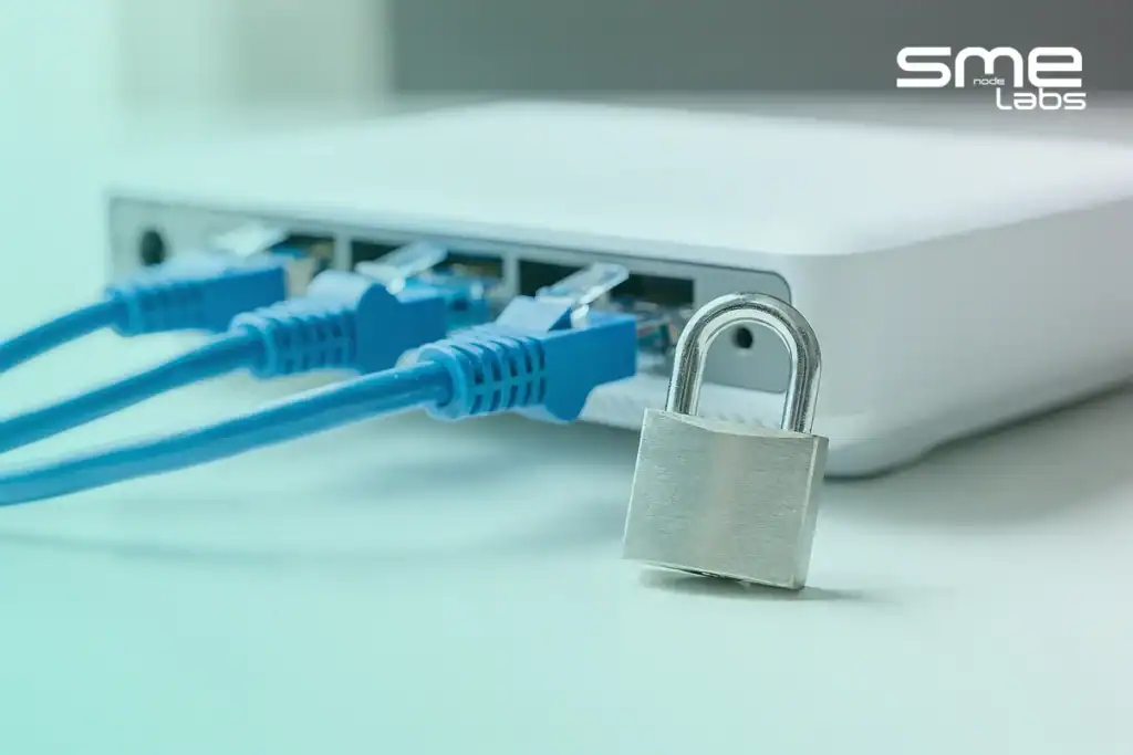 A padlock hanging on a blue Ethernet cable plugged into a router, representing MikroTik firewall rules