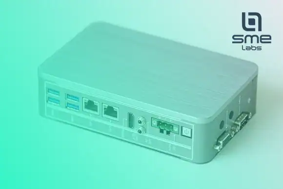 A small fanless network box with two Ethernet ports, USB ports and a serial port, under a mint-green fade from the bottom-left corner.