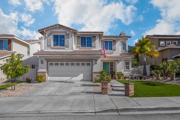 Modern two-story house in Yucaipa, CA with a well-maintained front yard and a two-car garage, ideal for homebuyers in Highland, CA.