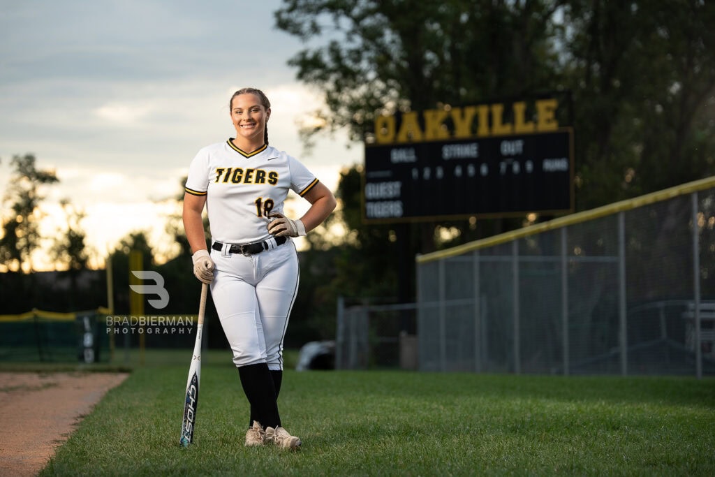 Amelia, Oakville High School senior, posing at Oakville High School in St. Louis for her senior portraits by Bierman Photography.