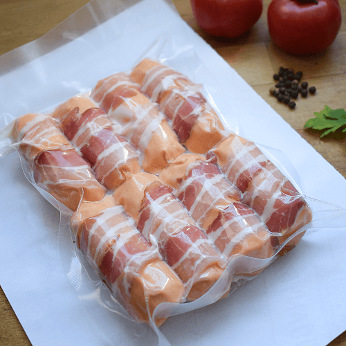 Pitufos envasats al buit (mini frankfurt amb formatge i bacon)