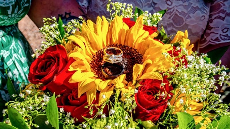 Wedding Rings on Sunflower Bouquet
