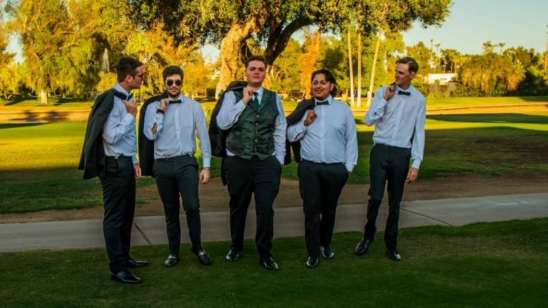 Groom and Groomsmen Walking in Park