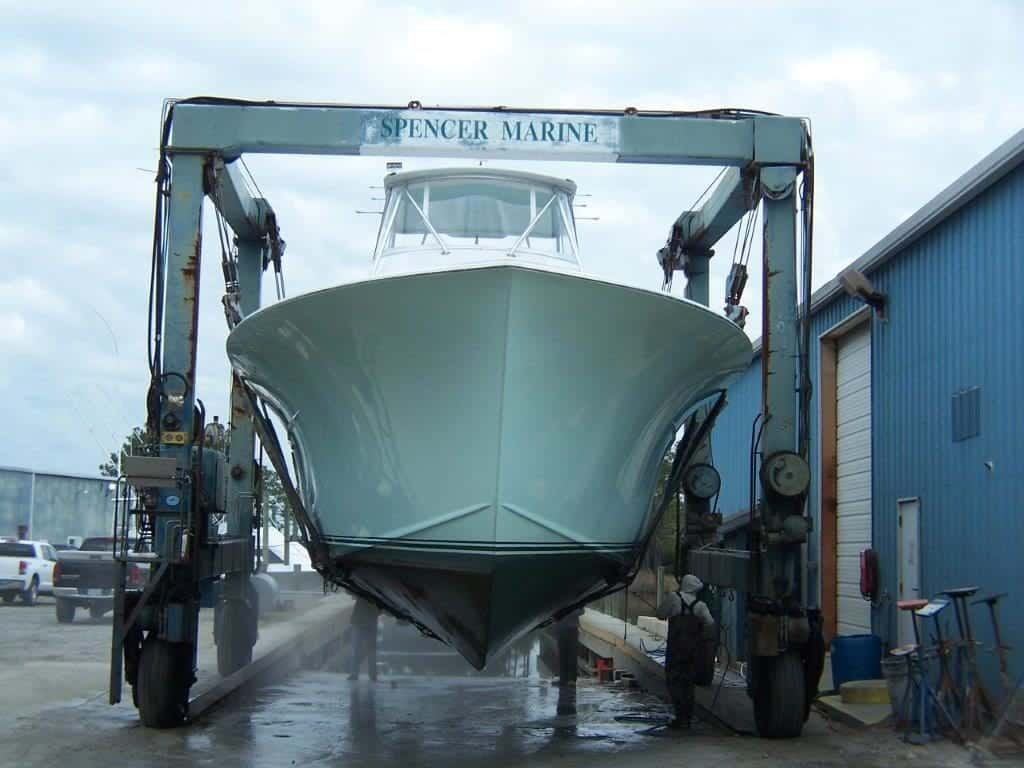 Spencer Marine travel lift hauling vessel from the water
