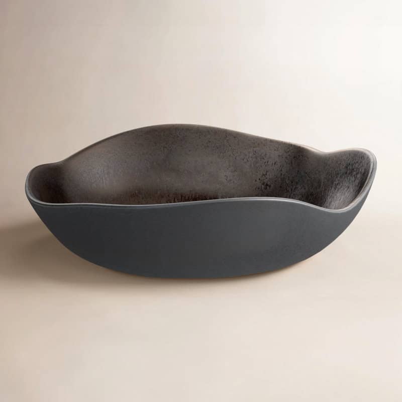 Elegant black ceramic serving bowl with a sleek, contemporary design.