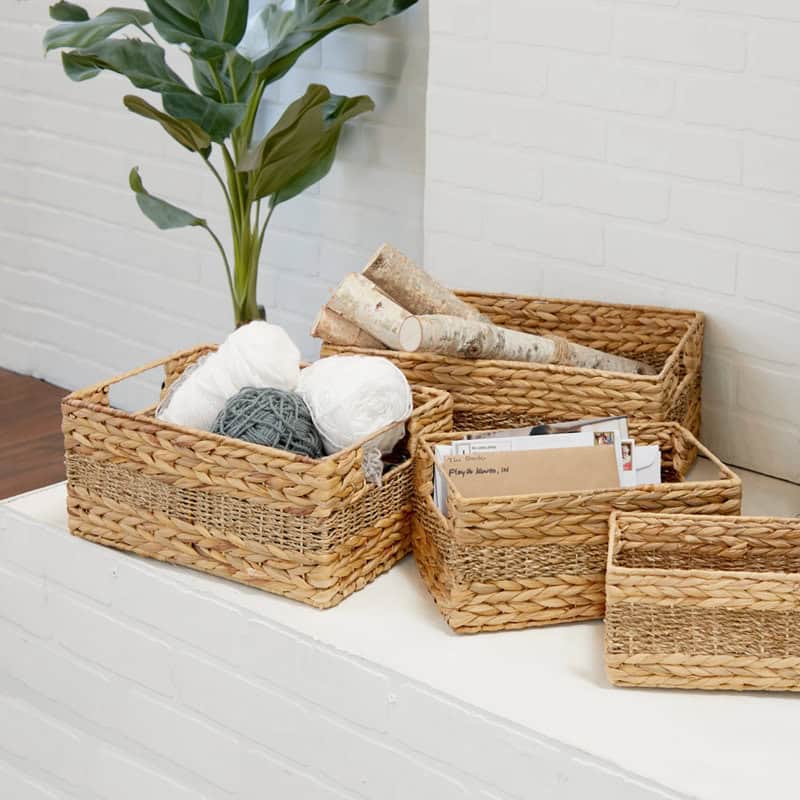 Four handmade seagrass baskets nested together