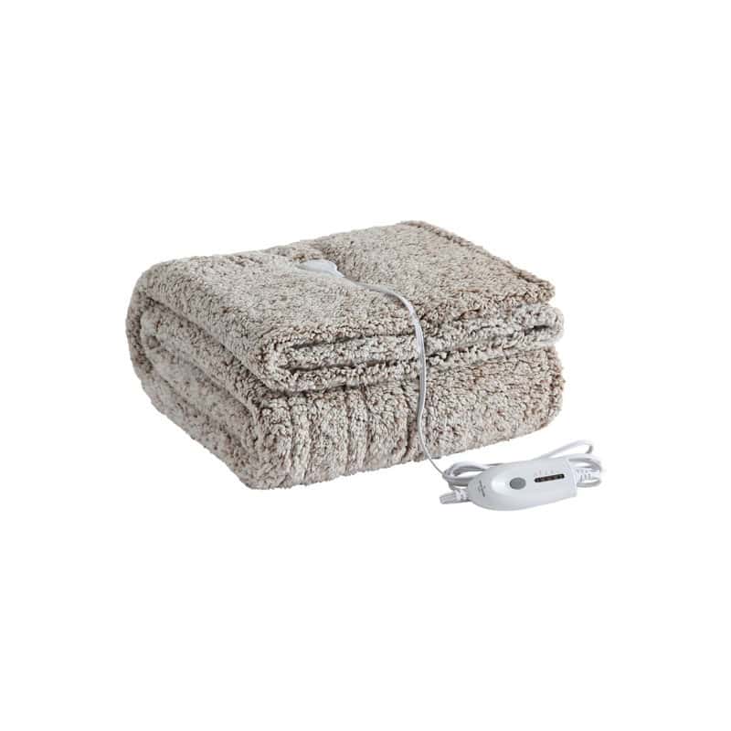 Brown reversible heated blanket folded on a bed